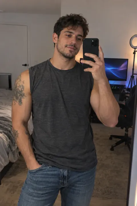 AI-generated adult male creator in a sleeveless tee beside a gaming setup